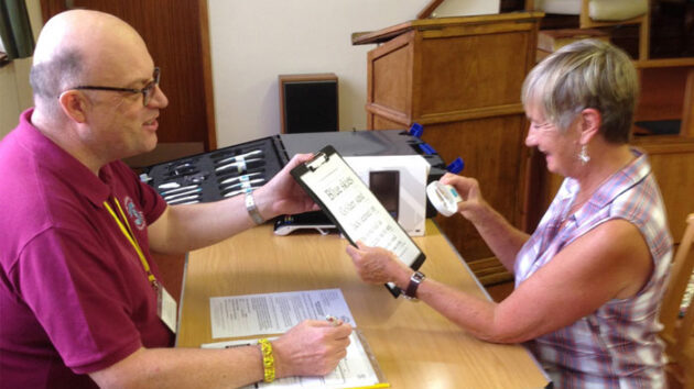 photo-of-man-and-woman-at-a-desk-rehab-service