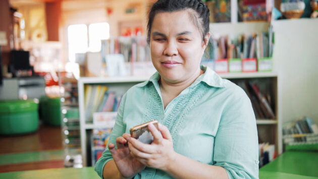 photograph-of-a-young-visually-impaired-lady-talking-on-the-phone