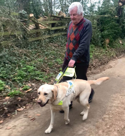 visually-impaired-man-walking-in-the-park-with-a-guide-dog